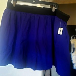 NWT. Adorable new large skirt with elastic waistband and pockets.